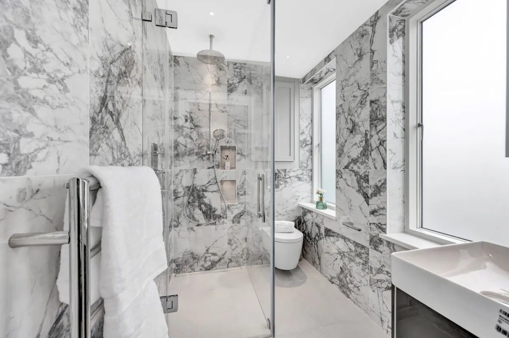 Soak in the Spalike Marble Bath at Plush Penthouse